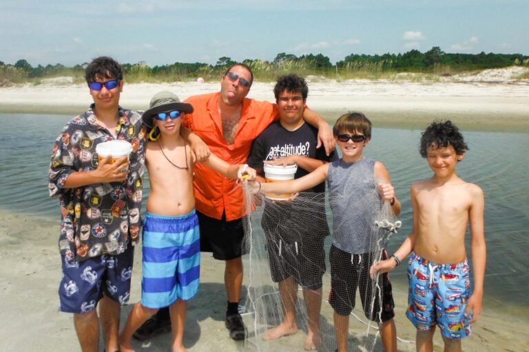 Campers holding fishing net