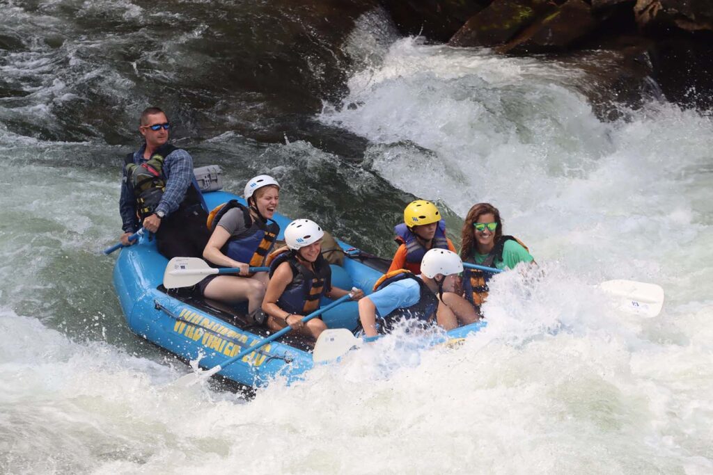 Campers whitewater rafting