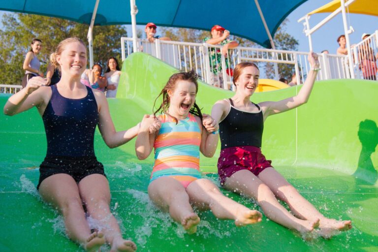 Campers on water slide