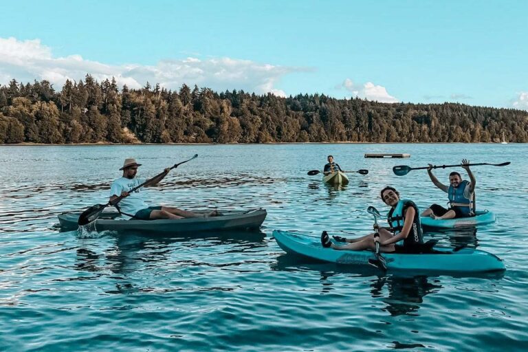 Campers kayaking on lake