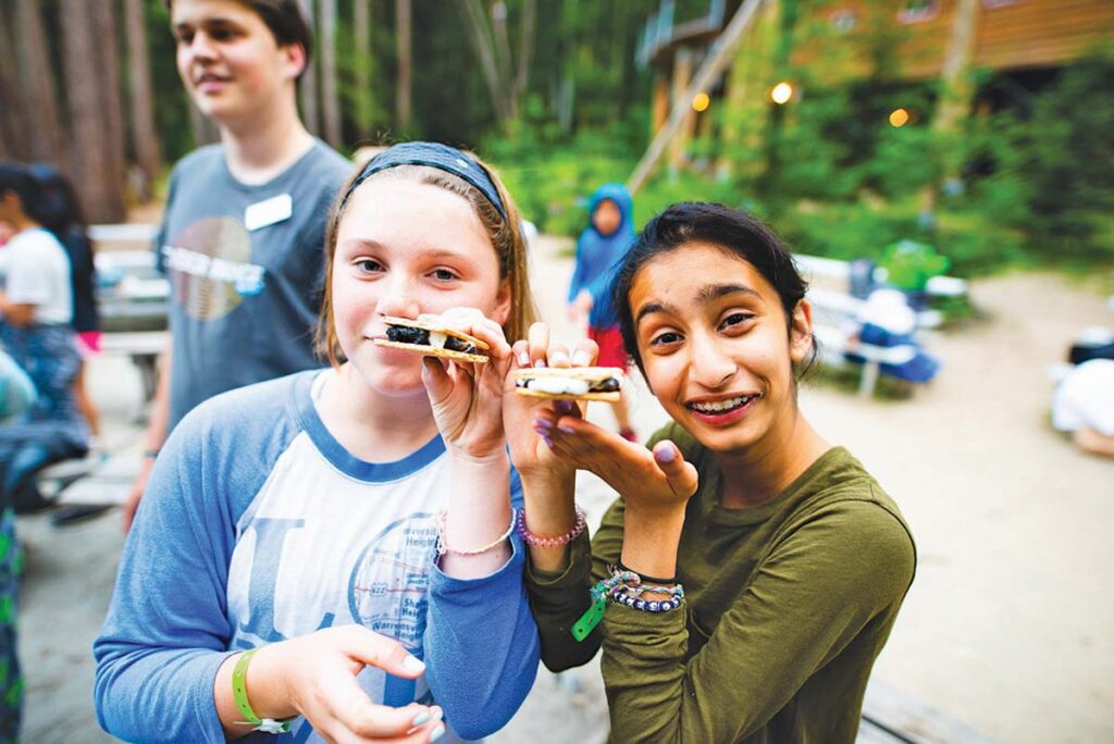 Campers holding s'mores