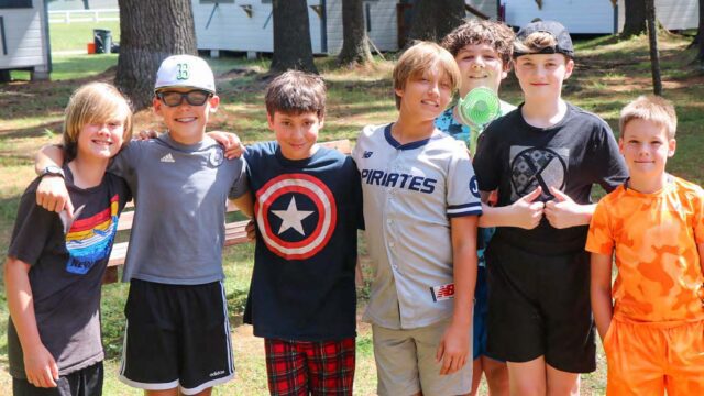 Group of boys near cabins