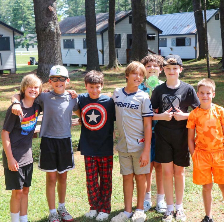 Group of boys near cabins
