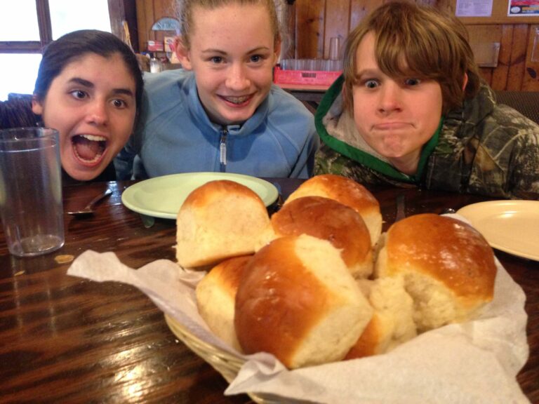 Campers with bread rolls