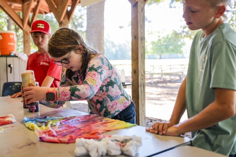 Girl making tie dye shirt