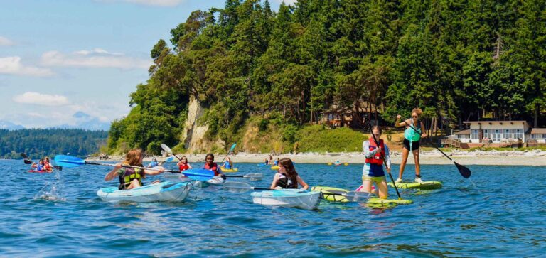 Campers kayaking and paddle boarding