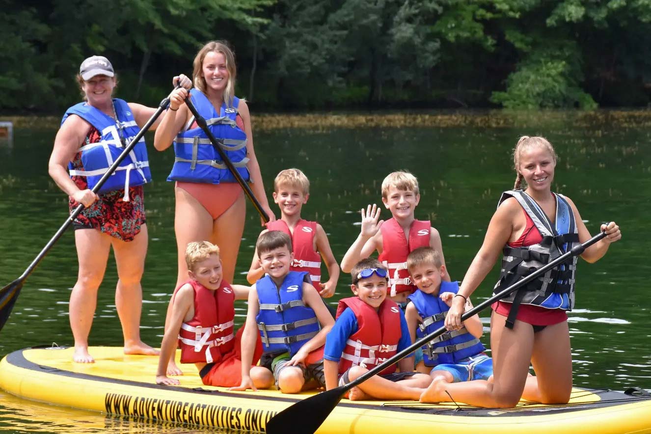 Boys on a large paddleboard