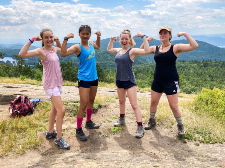 Girls on top of a mountain