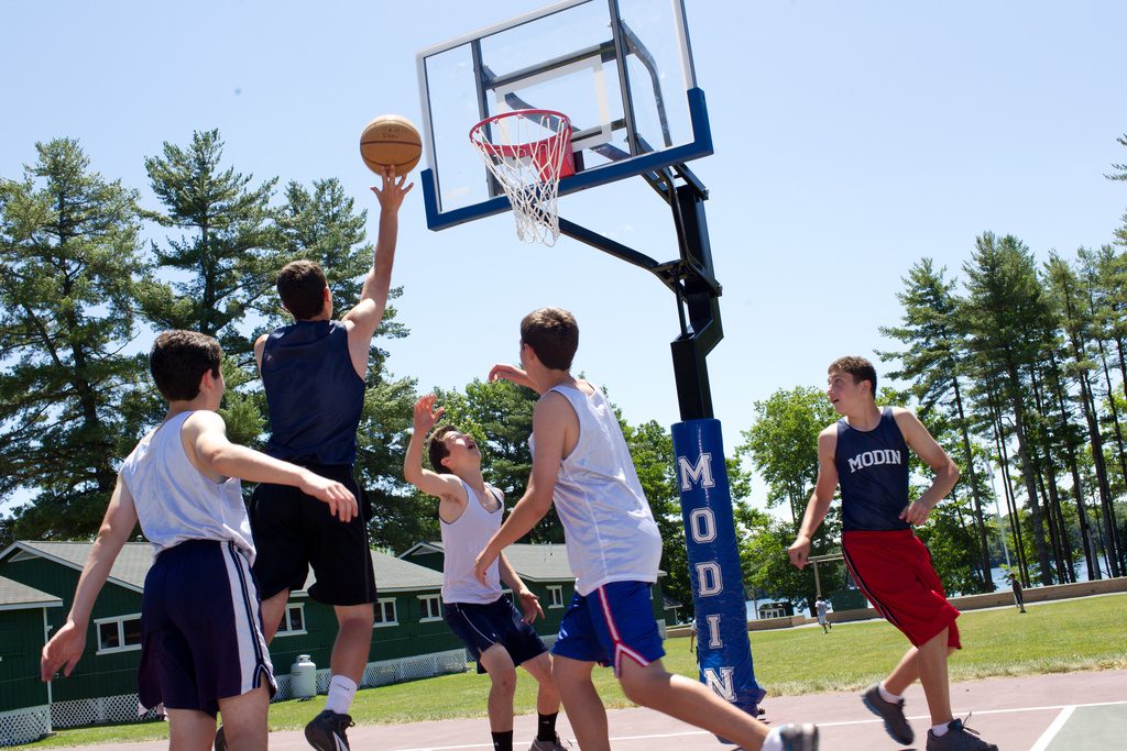 Teen boys playing basketball