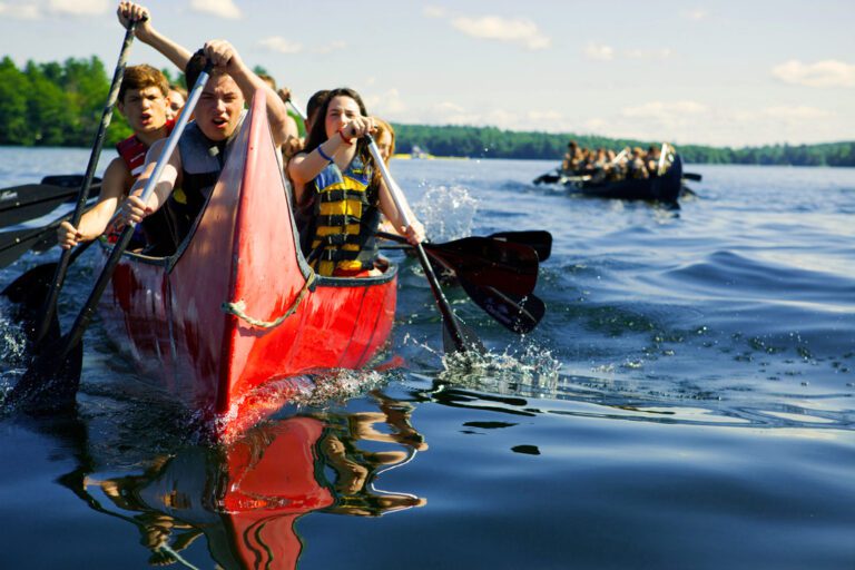 War canoes racing at camp