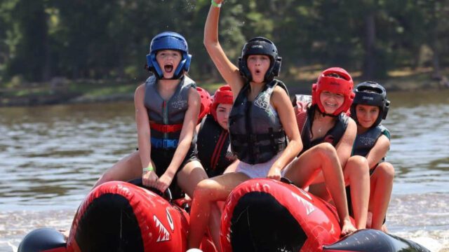 Excited campers lake tubing