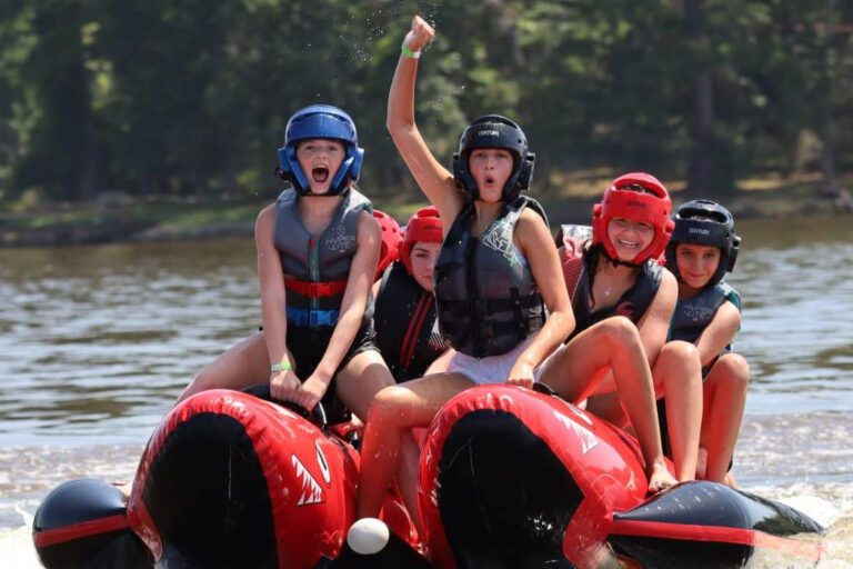 Excited campers lake tubing