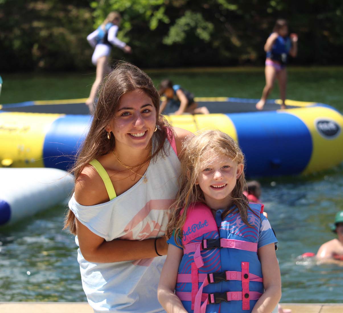 Happy campers near waterfront