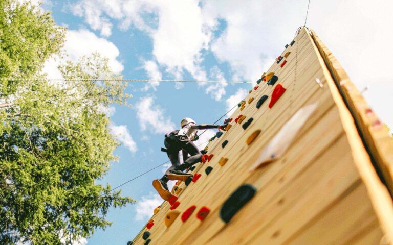 Camper on climbing wall