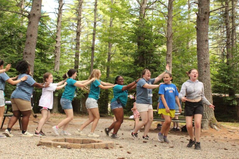 Campers in a line dance