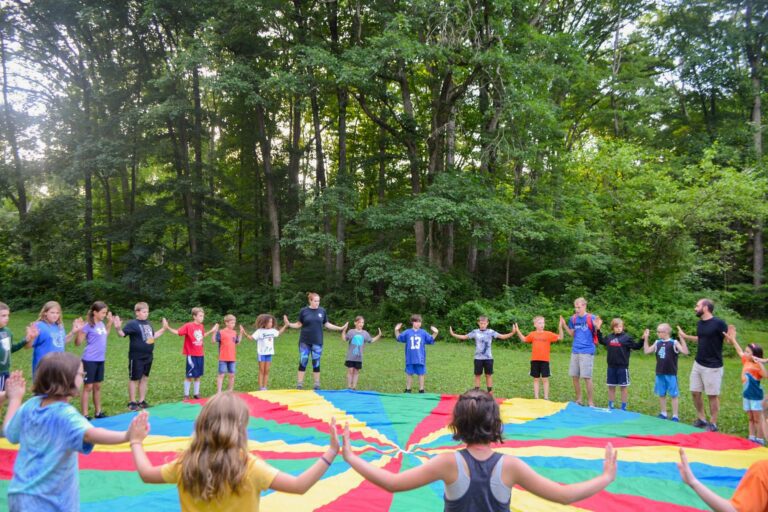 Group around giant play parachute