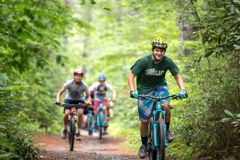 Campers riding mountain bikes