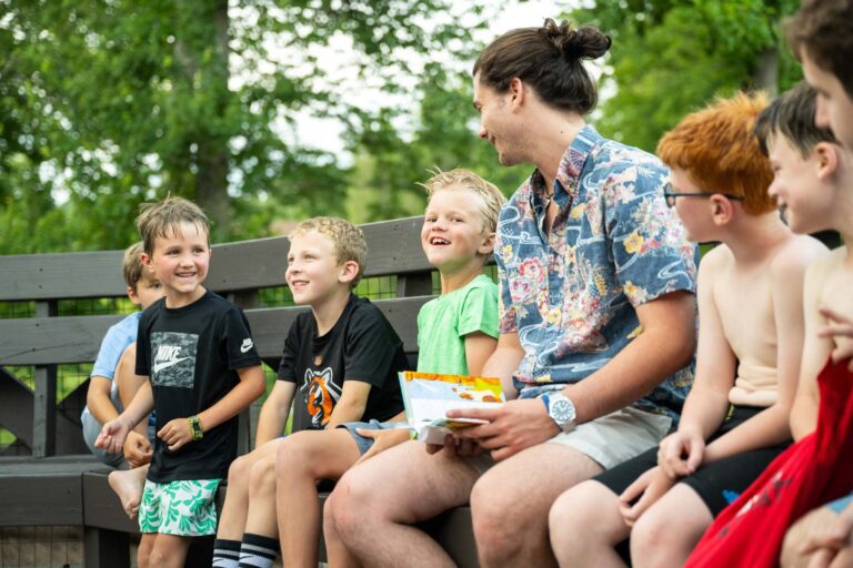Boys laughing with their counselor