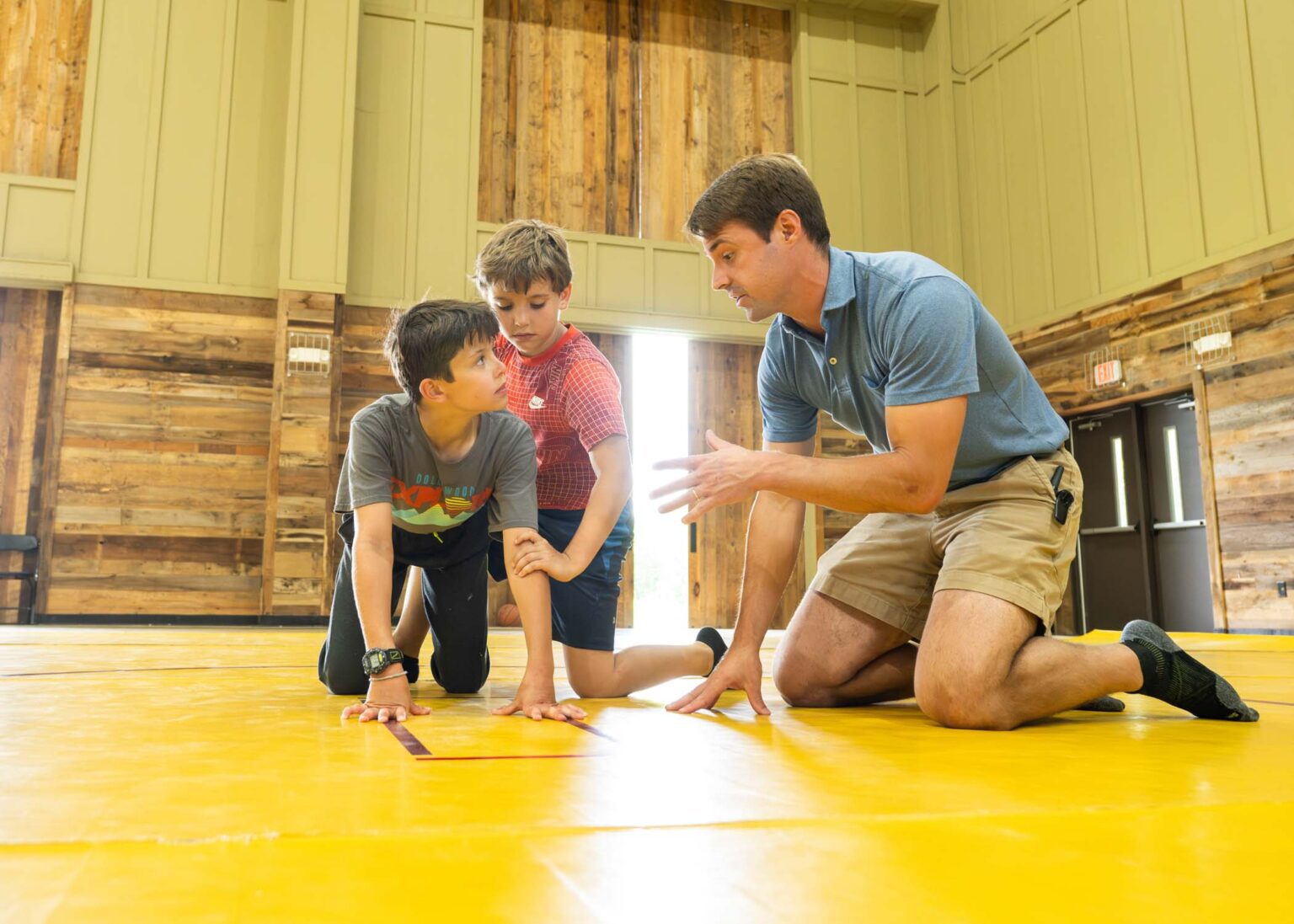 Boys learning wrestling technique