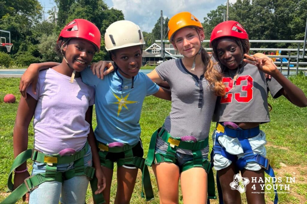 Happy campers wearing climbing gear