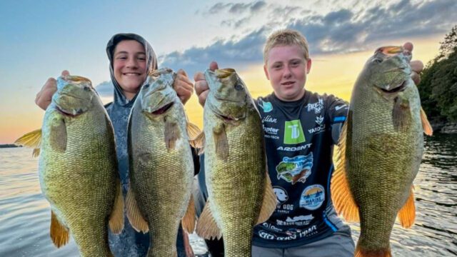 Boys holding large bass