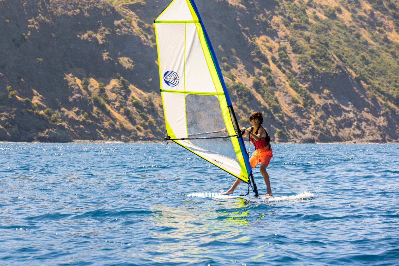 Boy windsurfing