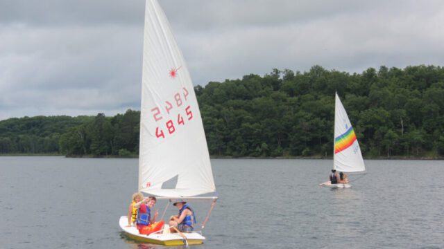 Campers in sailboats