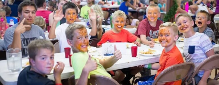 Boys with faces covered in food