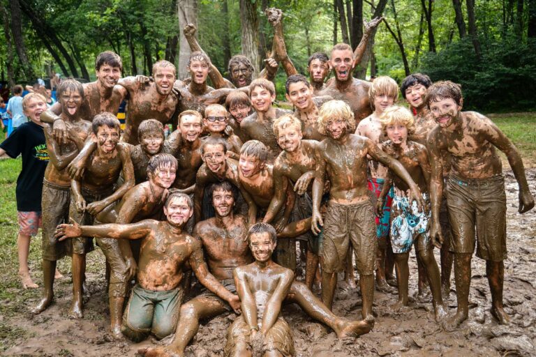 Group of happy muddy boys