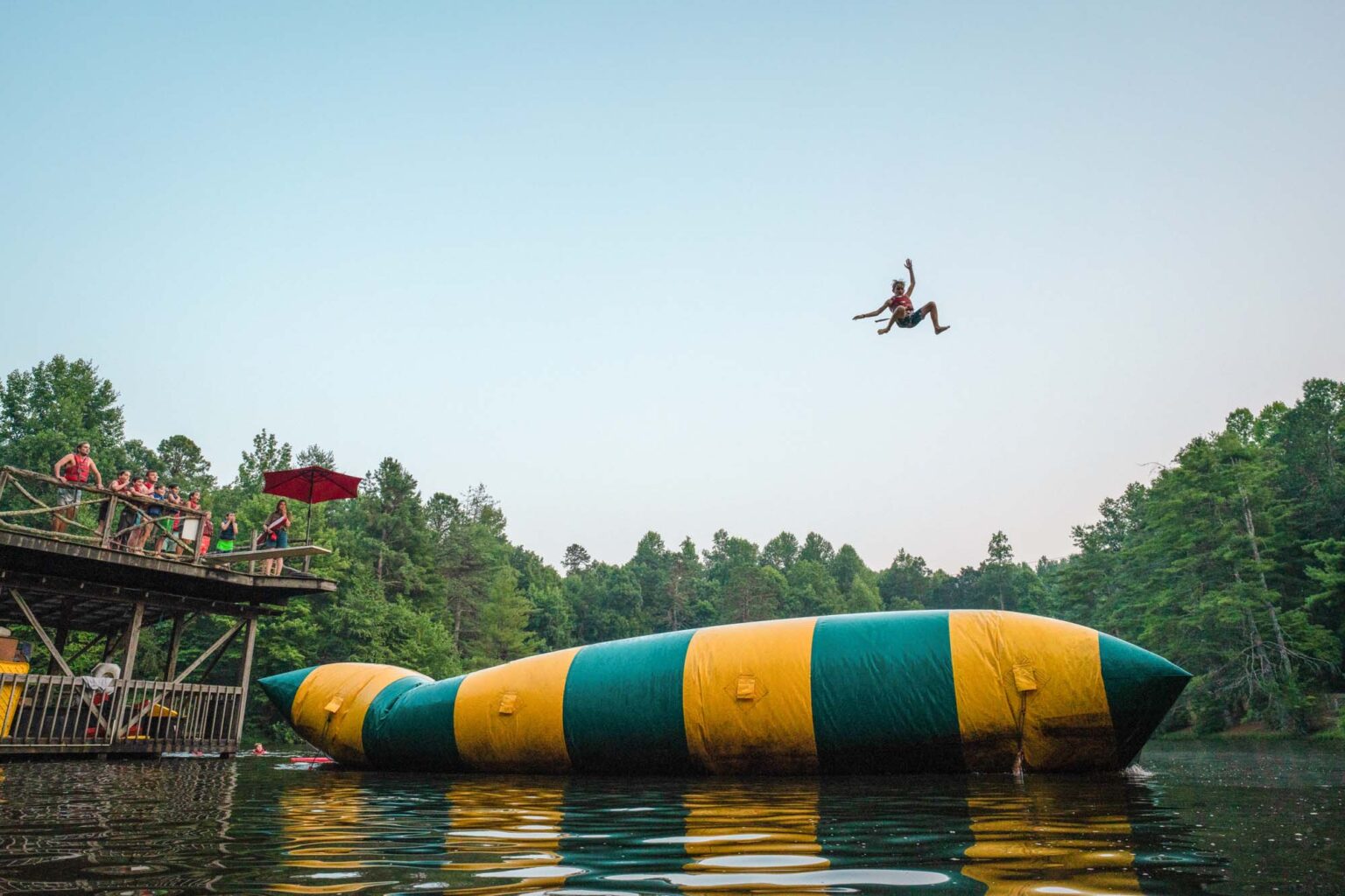 Boy getting huge air off lake blob