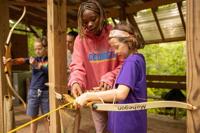 Girl learning archery