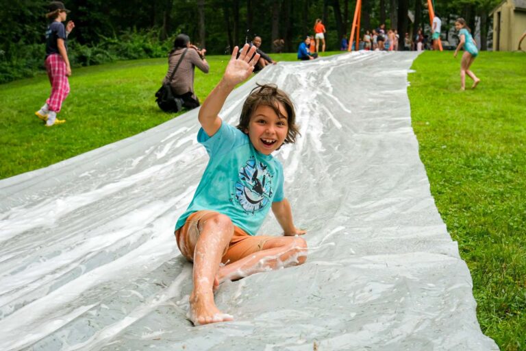 Happy boy on slip n slide