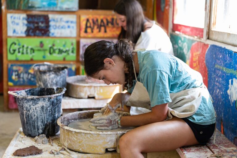 Girl using pottery wheel