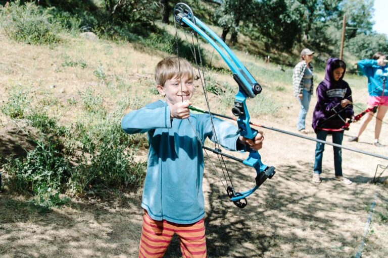 Boy holding archery bow