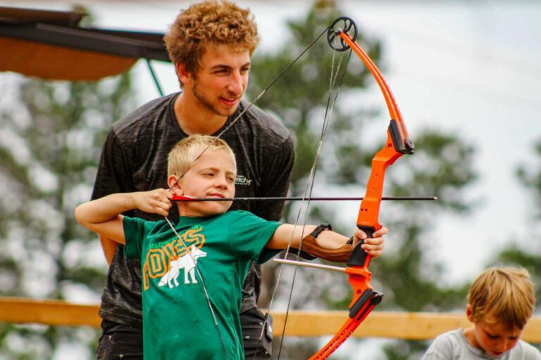 Boy holding archery bow