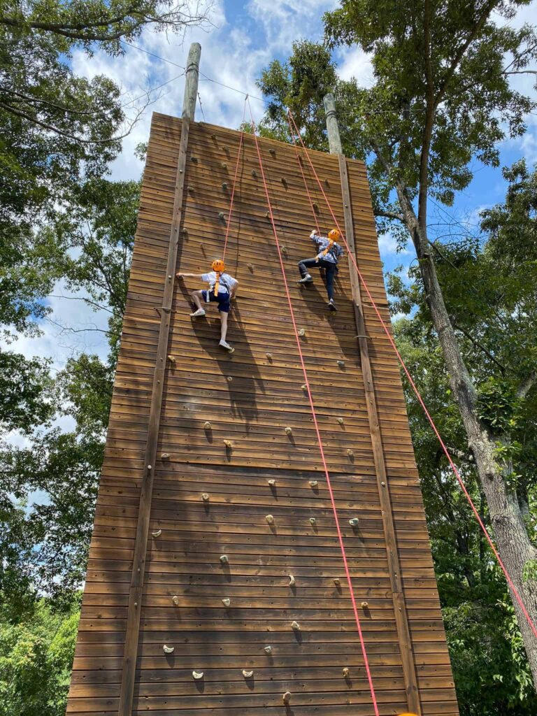 Campers on climbing wall