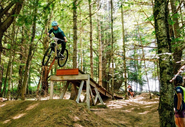 Mountain bike camper get air on a jump