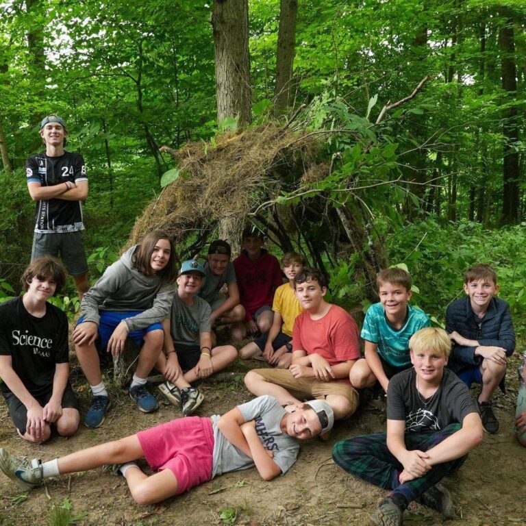 Boys near bushcraft shelter