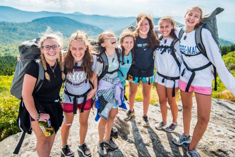Girls on top of a mountain