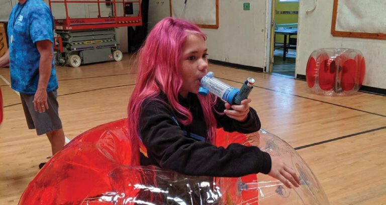 Girl holding inhaler