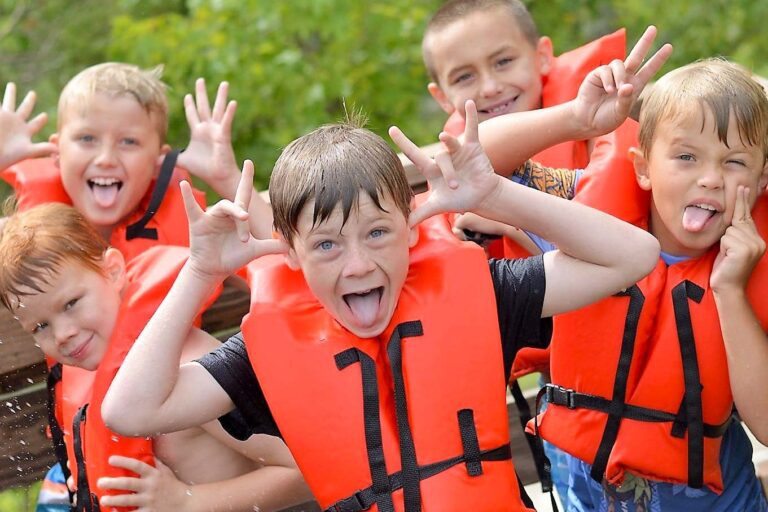 Silly boys wearing lifejackets