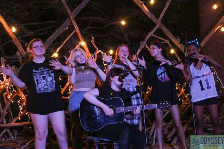 Campers singing on stage