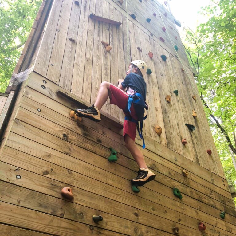 Boy on climbing wall
