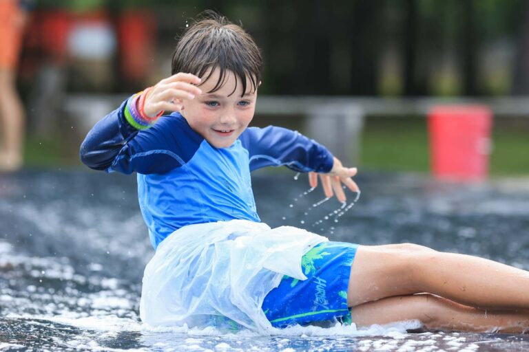 Boy on slip and slide