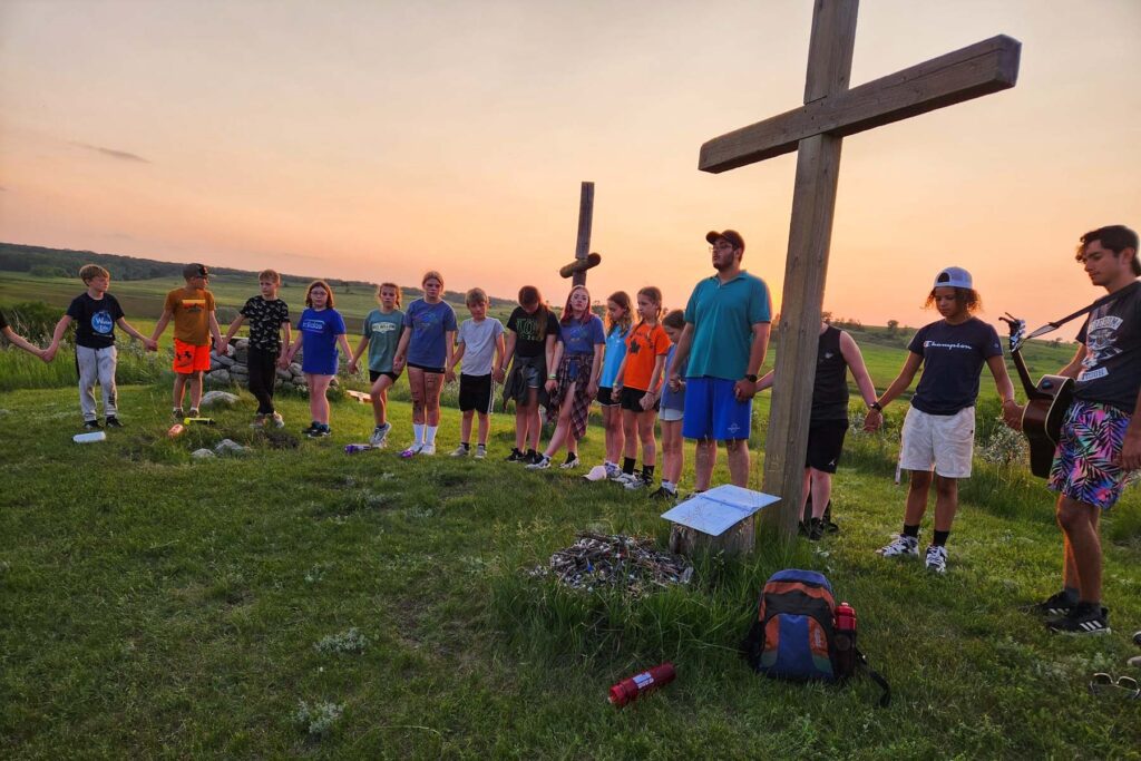 Camper worship at sunset