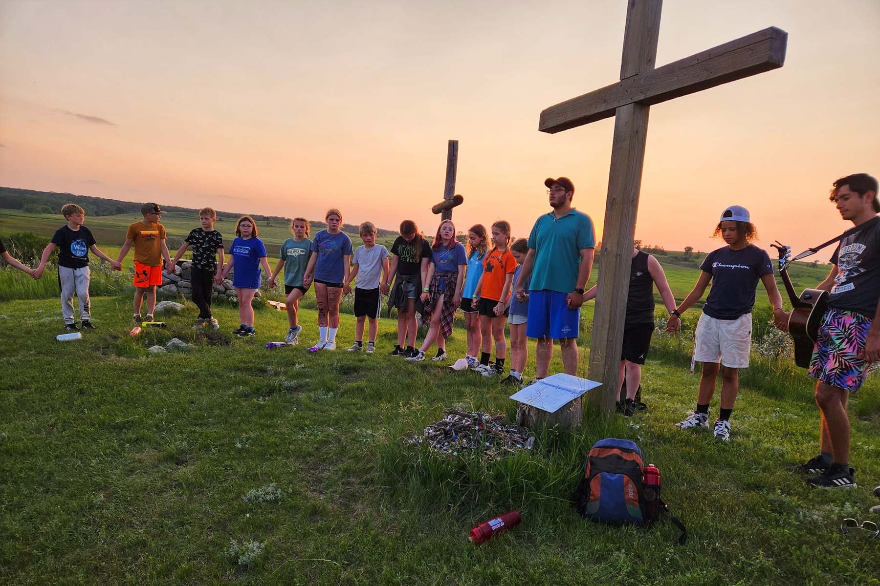 Camper worship at sunset