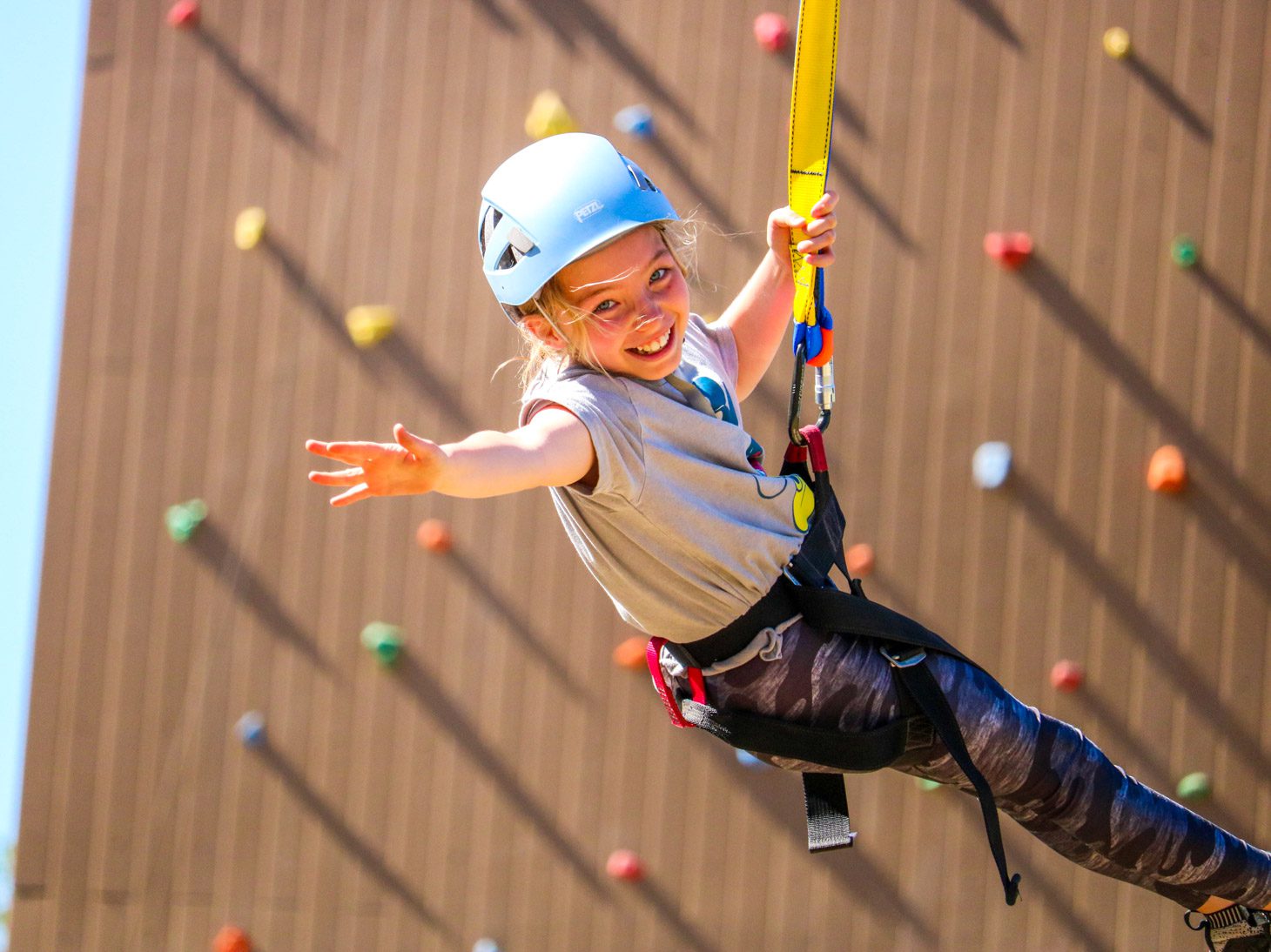 Camper on climbing wall