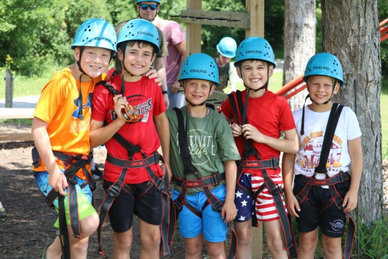 Boys wearing climbing gear
