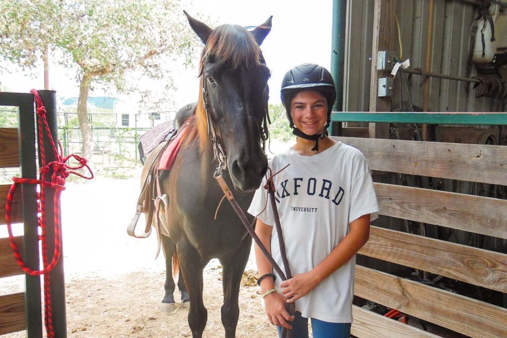 Girl next to horse