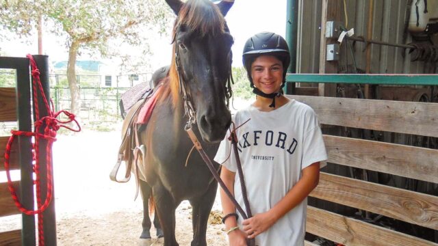 Girl next to horse